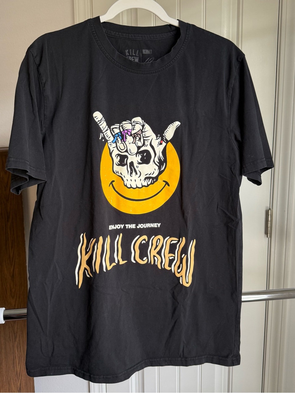 Kill Crew Black Tee with Yellow Smile Skull and Purple Accent